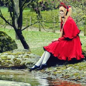Rating: Safe Score: 0 Tags: 1girl blonde_hair blue_eyes capelet doll_joints dress flower forest joints long_hair nature outdoors red_dress shinku sitting solo tree water User: admin