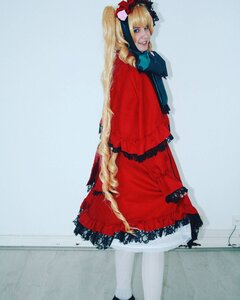 Rating: Safe Score: 0 Tags: 1girl blonde_hair blue_eyes bow dress drill_hair frills lips long_hair looking_at_viewer red_dress shinku solo standing twintails User: admin