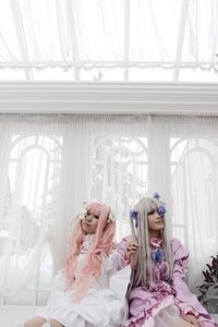 Rating: Safe Score: 0 Tags: dress flower frills hair_ornament indoors long_hair multiple_cosplay pink_hair sitting tagme window User: admin