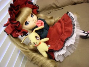 Rating: Safe Score: 0 Tags: 1girl auto_tagged blonde_hair blue_eyes bonnet bow doll dress frills hat long_hair long_sleeves looking_at_viewer photo red_dress rose shinku shoes sitting solo white_legwear User: admin