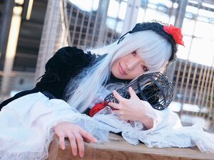 Rating: Safe Score: 0 Tags: 1girl bangs blurry blurry_background depth_of_field flower hair_ornament hairband lips lolita_fashion long_sleeves looking_at_viewer red_eyes solo suigintou white_hair User: admin