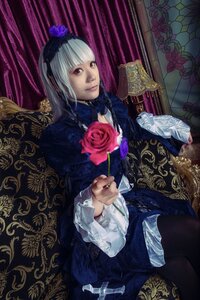 Rating: Safe Score: 0 Tags: 1girl bangs closed_mouth dress flower frilled_sleeves frills gothic_lolita hairband lolita_fashion long_sleeves looking_at_viewer nail_polish red_eyes rose sitting solo suigintou User: admin