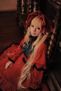 Rating: Safe Score: 0 Tags: 1girl blonde_hair blue_eyes bow dress indoors lips long_hair long_sleeves looking_at_viewer red_dress shinku sitting solo User: admin