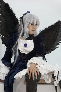 Rating: Safe Score: 0 Tags: 1girl angel_wings black_wings dress feathered_wings feathers frills gothic_lolita lace long_hair long_sleeves realistic ribbon silver_hair sitting solo suigintou wings User: admin