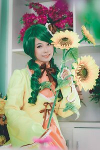 Rating: Safe Score: 0 Tags: 1girl blurry dress flower green_hair kanaria long_hair photo ribbon smile solo sunflower window User: admin