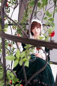 Rating: Safe Score: 0 Tags: 1girl blurry blurry_foreground brown_hair depth_of_field dress flower green_eyes heterochromia lips looking_at_viewer plant solo suiseiseki vines User: admin