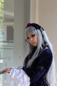 Rating: Safe Score: 0 Tags: 1girl blurry dress flower hairband holding lips long_hair long_sleeves silver_hair solo suigintou User: admin