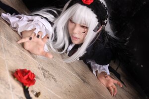 Rating: Safe Score: 0 Tags: 1girl blurry depth_of_field doll_joints dress fingernails flower gothic_lolita hairband joints lolita_fashion long_hair long_sleeves nail_polish one_eye_closed red_eyes red_flower red_rose rose silver_hair solo suigintou User: admin