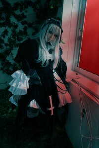Rating: Safe Score: 0 Tags: 1girl bangs black_dress closed_mouth dress expressionless frills gothic_lolita hairband long_hair long_sleeves red_eyes ribbon sitting solo suigintou User: admin