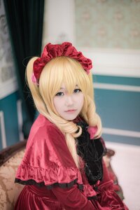 Rating: Safe Score: 0 Tags: 1girl blonde_hair blue_eyes blurry blurry_background capelet depth_of_field dress drill_hair flower lips long_hair looking_at_viewer photo red_dress shinku solo User: admin