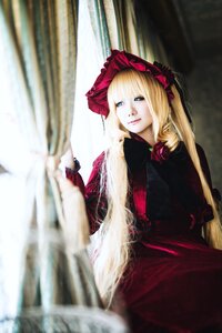 Rating: Safe Score: 0 Tags: 1girl blonde_hair blue_eyes blurry bonnet curtains depth_of_field dress flower long_hair long_sleeves looking_at_viewer red_dress rose shinku sitting solo twintails User: admin
