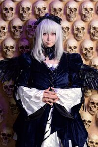 Rating: Safe Score: 0 Tags: 1girl dress frills lips long_hair long_sleeves looking_at_viewer red_eyes sitting skull solo suigintou white_hair User: admin