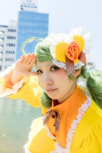 Rating: Safe Score: 0 Tags: 1girl blurry building day depth_of_field dress flower frills green_hair hat kanaria lips outdoors ribbon solo upper_body yellow_dress User: admin