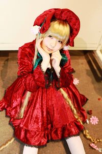 Rating: Safe Score: 0 Tags: 1girl blonde_hair blurry bonnet depth_of_field dress flower long_hair long_sleeves looking_at_viewer red_dress shinku sitting solo User: admin