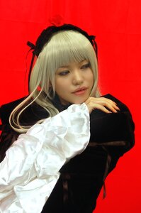 Rating: Safe Score: 0 Tags: 1girl bangs black_dress blonde_hair eyelashes flower hairband lips long_hair long_sleeves looking_at_viewer realistic red_background red_lips rose simple_background solo suigintou upper_body User: admin