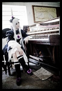Rating: Safe Score: 0 Tags: 1girl auto_tagged boots dress frills long_hair sitting solo suigintou wings User: admin