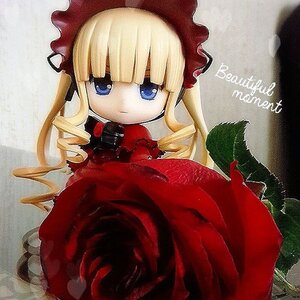 Rating: Safe Score: 0 Tags: 1girl bangs blonde_hair blue_eyes bonnet bow dress drill_hair hat long_hair long_sleeves looking_at_viewer red_dress shinku sitting solo twintails User: admin