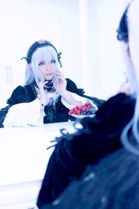 Rating: Safe Score: 0 Tags: 1girl blurry blurry_background blurry_foreground cake depth_of_field dress flower food frills hairband long_hair long_sleeves silver_hair sitting solo suigintou User: admin