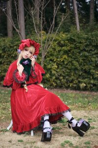 Rating: Safe Score: 0 Tags: 1girl black_footwear blue_eyes bonnet dress frills long_sleeves outdoors red_dress shinku shoes sitting solo User: admin