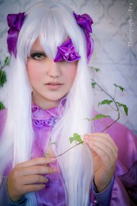 Rating: Safe Score: 0 Tags: 1girl artist_name barasuishou blurry bow depth_of_field flower hair_bow holding leaf lips looking_at_viewer nose plant purple_bow purple_flower solo watermark yellow_eyes User: admin