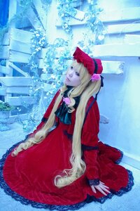 Rating: Safe Score: 0 Tags: 1girl blonde_hair blue_eyes bonnet bow dress flower frills long_hair long_sleeves red_dress rose shinku sitting solo User: admin