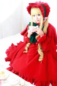 Rating: Safe Score: 0 Tags: 1girl blonde_hair blue_eyes bonnet cup dress drill_hair flower long_hair long_sleeves looking_at_viewer red_dress saucer shinku solo teacup User: admin