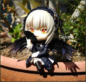 Rating: Safe Score: 0 Tags: 1girl black_wings doll dress feathers frills hairband holding looking_at_viewer photo silver_hair solo suigintou wings User: admin