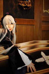 Rating: Safe Score: 0 Tags: 1girl bird black_dress dress feathers indoors lips long_hair long_sleeves one_eye_closed silver_hair solo suigintou User: admin