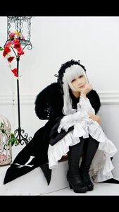 Rating: Safe Score: 0 Tags: 1girl black_footwear boots dress flower frills hairband letterboxed long_hair long_sleeves looking_at_viewer sitting solo suigintou white_hair User: admin