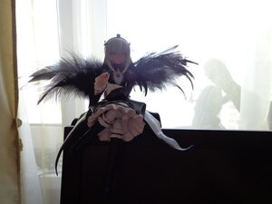 Rating: Safe Score: 0 Tags: 1girl bangs breasts closed_mouth doll dress feathers frills from_below holding long_hair solo standing suigintou wings User: admin