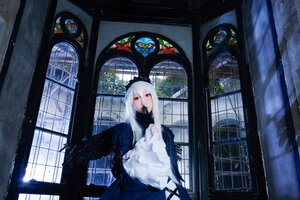 Rating: Safe Score: 0 Tags: 1girl dress feathers holding indoors long_hair long_sleeves solo stained_glass standing suigintou window wings User: admin