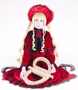 Rating: Safe Score: 0 Tags: 1girl blonde_hair blue_eyes bonnet bow dress flower long_hair long_sleeves looking_at_viewer red_capelet red_dress red_flower rose shinku shoes sitting smile solo twintails very_long_hair User: admin