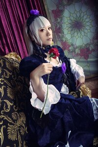 Rating: Safe Score: 0 Tags: 1girl bangs dress flower frills gothic_lolita hairband holding_flower lips lolita_fashion long_hair long_sleeves looking_at_viewer rose sitting solo suigintou User: admin