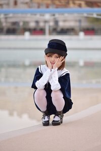 Rating: Safe Score: 0 Tags: 1girl blue_headwear blurry blurry_background blurry_foreground brown_eyes brown_hair depth_of_field dress hands_on_own_cheeks hands_on_own_face hat long_sleeves looking_at_viewer outdoors photo photo_background short_hair smile solo souseiseki squatting User: admin