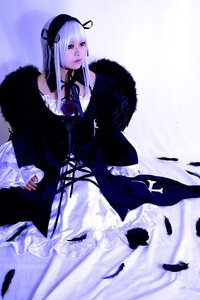 Rating: Safe Score: 0 Tags: 1girl bird black_feathers dress feathers frills fur_trim long_hair long_sleeves ribbon solo suigintou User: admin