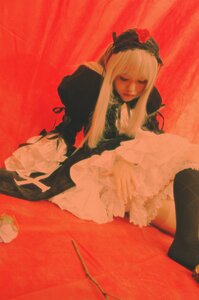Rating: Safe Score: 0 Tags: 1girl blonde_hair closed_eyes dress flower frills gothic_lolita lips long_hair long_sleeves red_background rose sitting solo suigintou User: admin