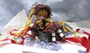 Rating: Safe Score: 0 Tags: 1girl blonde_hair blue_eyes bonnet bow doll dress figure frills long_hair long_sleeves looking_at_viewer photo_(medium) red_dress ribbon rozen_maiden shinku shoes sitting solo twintails User: admin