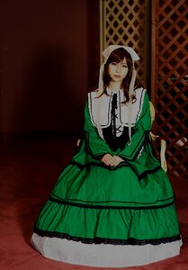 Rating: Safe Score: 0 Tags: 1girl brown_hair dress green_dress green_eyes long_hair long_sleeves looking_at_viewer sitting solo suiseiseki User: admin