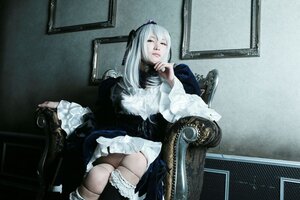 Rating: Safe Score: 0 Tags: 1girl bangs boots dress frills hairband indoors long_hair long_sleeves sitting solo suigintou white_hair User: admin