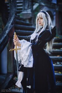 Rating: Safe Score: 0 Tags: 1girl black_dress blurry blurry_background depth_of_field dress frills hairband holding lips long_hair long_sleeves outdoors solo standing suigintou sword weapon User: admin