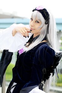 Rating: Safe Score: 0 Tags: 1girl black_dress blurry blurry_background closed_mouth depth_of_field dress flower frilled_sleeves frills gothic_lolita hairband long_hair long_sleeves nail_polish rose silver_hair solo suigintou User: admin