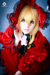 Rating: Safe Score: 0 Tags: 1girl blonde_hair blue_eyes bow dress flower lace lips long_sleeves looking_at_viewer red_capelet red_dress ribbon rose shinku smile solo User: admin