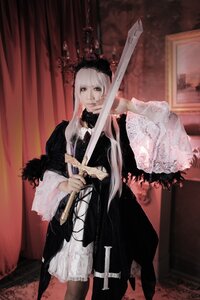Rating: Safe Score: 0 Tags: 1girl curtains dress frills indoors long_hair long_sleeves solo standing suigintou sword weapon white_hair User: admin