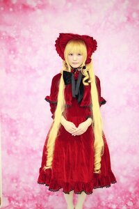 Rating: Safe Score: 0 Tags: 1girl blonde_hair blue_eyes bonnet dress long_hair looking_at_viewer pink_background red_dress shinku solo standing User: admin