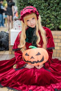 Rating: Safe Score: 0 Tags: 1girl blonde_hair blue_eyes blurry blurry_background blurry_foreground depth_of_field dress frills jack-o'-lantern lolita_fashion long_hair long_sleeves looking_at_viewer photo pumpkin red_dress shinku sitting smile solo solo_focus User: admin