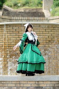 Rating: Safe Score: 0 Tags: 1girl brick_wall brown_hair dress full_body gloves green_dress long_sleeves outdoors solo standing suiseiseki User: admin
