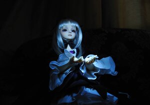 Rating: Safe Score: 0 Tags: 1girl dark doll dress holding long_hair long_sleeves sitting solo suigintou User: admin