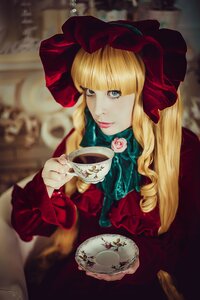 Rating: Safe Score: 0 Tags: 1girl bangs blonde_hair blue_eyes blurry blurry_background bonnet bow cup depth_of_field dress flower lips long_hair looking_at_viewer rose saucer shinku solo tea teacup User: admin