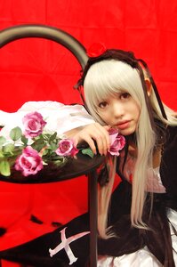 Rating: Safe Score: 0 Tags: 1girl blonde_hair dress flower hairband lips long_hair long_sleeves pink_flower pink_rose red_background rose solo suigintou User: admin