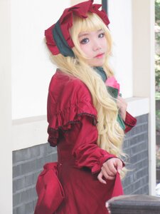 Rating: Safe Score: 0 Tags: 1girl bangs blonde_hair blue_eyes blurry bonnet bow dress lips lolita_fashion long_hair long_sleeves looking_at_viewer outdoors red_dress shinku solo User: admin